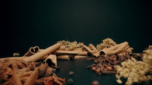 Variety of Spices and Herbs on Dark Surface