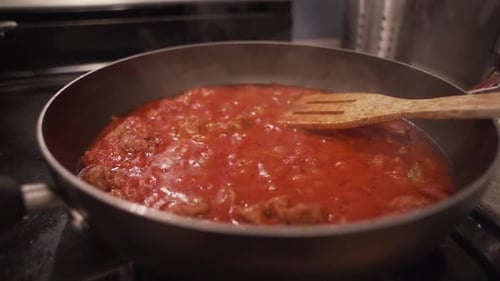 Bubbling Meat Sauce in Pan with Spatula
