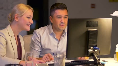 Business, Deadline and Success Concept - Coworkers with Computer Working Late At