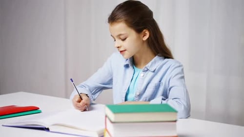 Happy School Girl Studying at Home