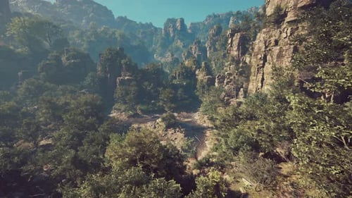 A Scenic View of a Mountain with Trees and Mountains in the Background