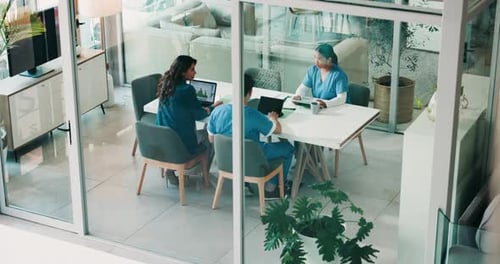 Doctors, meeting and people in boardroom at hospital, above and discussion with paperwork