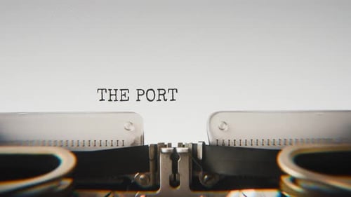 Old mechanical typewriter typing The Portrait Watched In Silence in a close-up view.