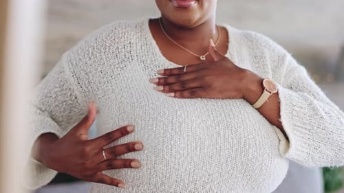 Breast cancer, self exam and black woman with hands on chest for testing
