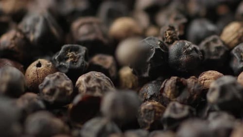 Dried Black Peppercorns Falling, Extreme Close Up Of Pepper Spice Seeds