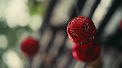 Red Spherical Ornaments Hanging and Swaying
