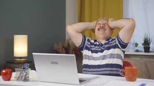 Home office worker old man having a nervous breakdown.