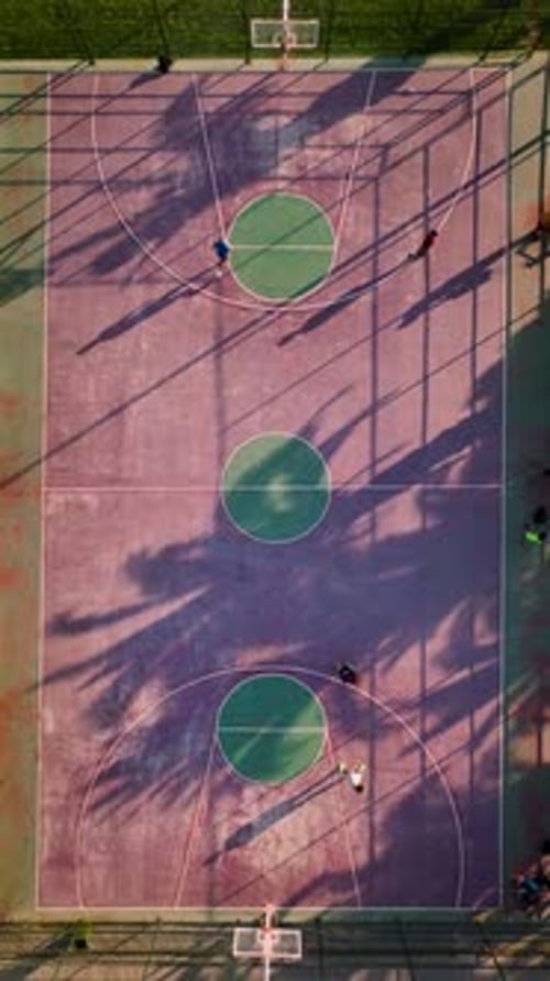 Aerial View of Basketball Court with Active Players