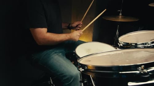 Expressive Drummer Young Man Professionally Playing on Dums in Studio Room Closeup Rock Metall Music