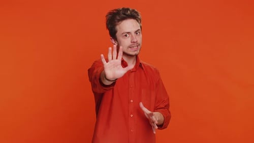 Young Man Says No Hold Palm Folded Crossed Hands in Stop Gesture Warning of Finish Prohibited Access