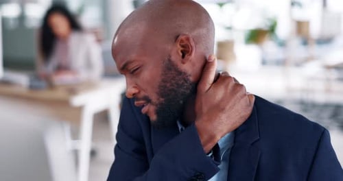 Black man, neck pain and business stress in burnout, fatigue or overworked at the office