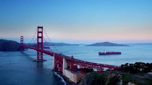 Container ship travels under Golden Gate Bridge in San Francisco bay California