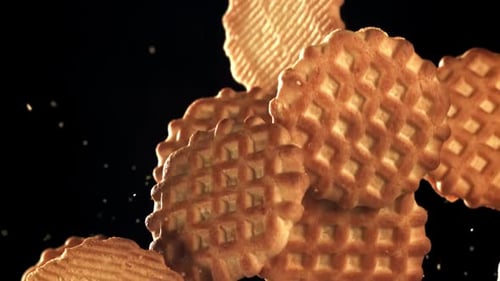 Cookies Flying on a Black Backdrop