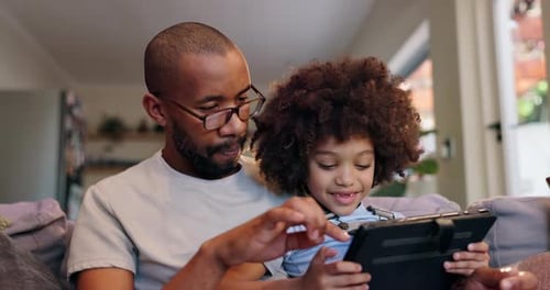Child, father and scroll tablet on sofa at house for reading ebook online