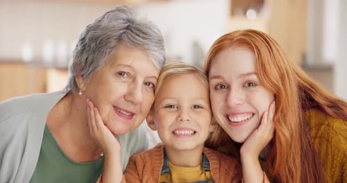 Three Generations of Women Smiling Together at Home