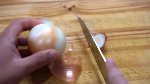 slicing onion chopping into julienne on wooden board kitchen healthy healthy diet