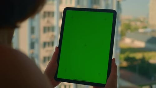Female Using Digital Tablet in Apartment