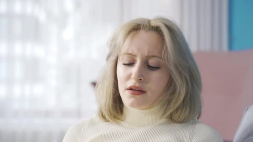 Frustrated Woman Using Phone at Home