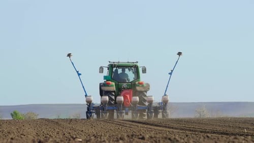Agricultural tractor working in field
