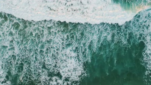 Foamy Waves Rolling on Turquoise Beach