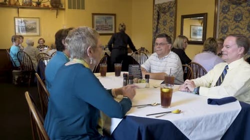 Closeup shot of business people talking while waiting for their food to be delivered at a restaurant