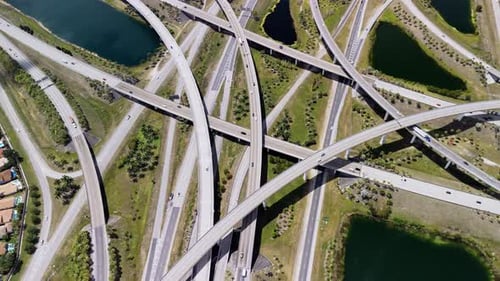 Highway Interchange in Miami City Bustling with Fastmoving Vehicles Showcasing US Transportation