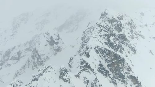 Amazing aerial shot of the snow covered mountains of Georgia, 4k