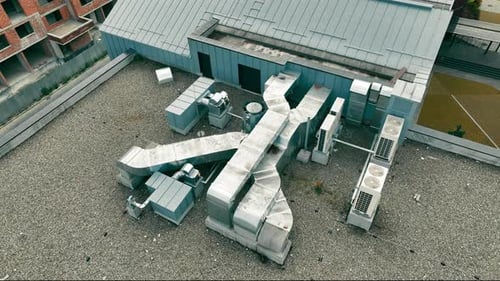 Aerial View Ventilation And Air Conditioners On The Roof Of A Multistory Building