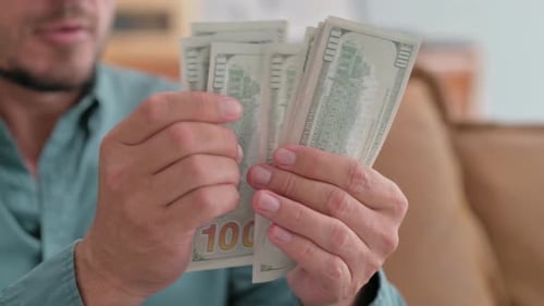 Close up of Man Counting Money, Earning