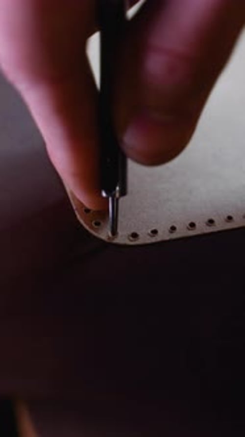 CloseUp of Leather Marking with a Template and Awl