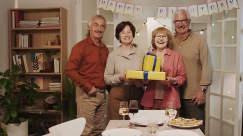 Seniors Gather for Birthday Celebration at Home