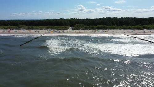Baltic Sea coast beach Hel aerial drone top view 4K UHD video. People on the beach. Aerial View