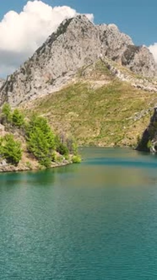 Vertical Video Aerial Footage of Paddleboarding in the Green Canyon Highlights Clear Waters and
