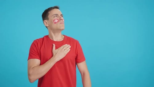Man Listening to the Switzerland National Anthem with Solemnity