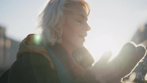 Beautiful Winter Day Middleaged Blonde Lady Walking Blowing Snow From Hands Attractive Blonde Woman