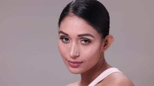 Close-up of a beautiful blonde woman with a healthy smile looking at the camera
