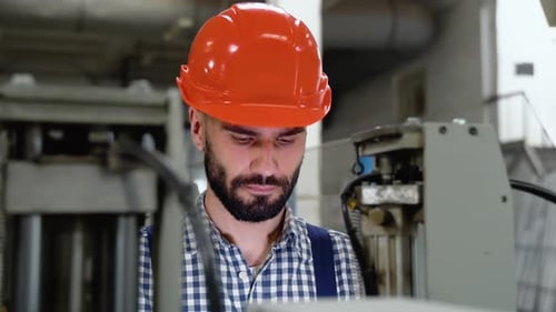 Smiling Industrial Specialist Standing in a Metal Construction Manufacture