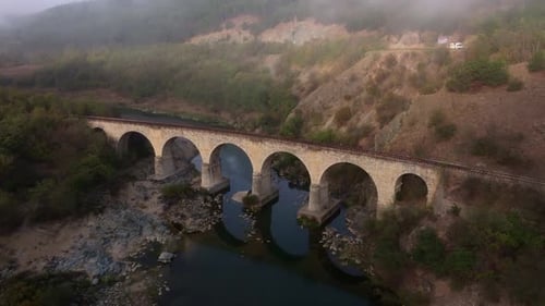 Aerial view of railway bridge over river at sunrise, Bulgaria.