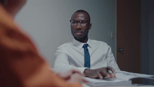 Black Detective Interrogating Criminal