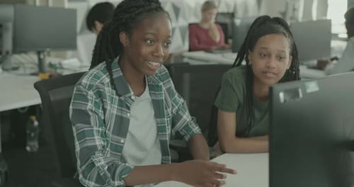Female Education Students in Classroom Learning Computer Technology