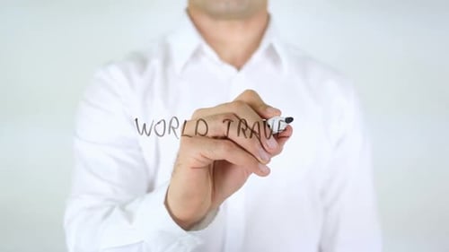 Man Writes World Travel on Clear Surface