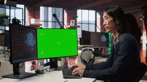 AI Startup Office Senior Developer Building Application on Green Screen Computer