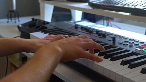 Hands Play Electronic Keyboard Instrument in Studio