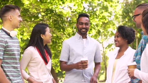 Diverse Group of Friends Chatting in a Park