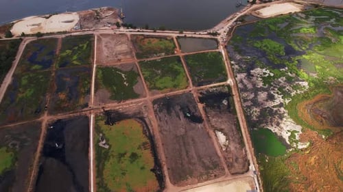 Aerial View of Industrial Site with Containment Ponds
