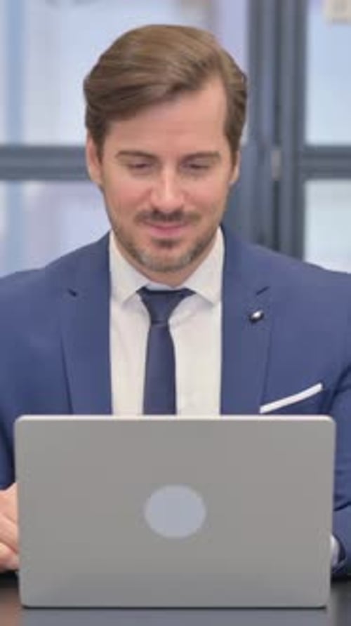 Corporate Man Video Conferencing Using Laptop Device