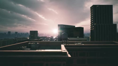Sunset Over a City Skyline with Modern Buildings and Cloudy Skies