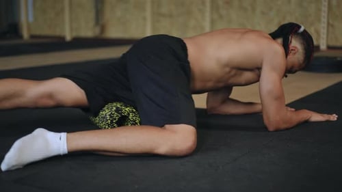 Fit Man Doing Dynamic Stretch at Gym