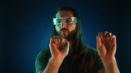 Businessman with Augmented Reality Glasses Working in Virtual Office