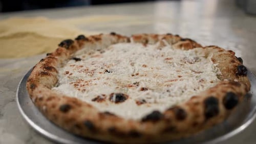 Hot delicious pizza 4 cheeses in the restaurant ready to serve - traditional italian cuisine